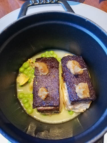 Amberjack, clams, olives, and peas
